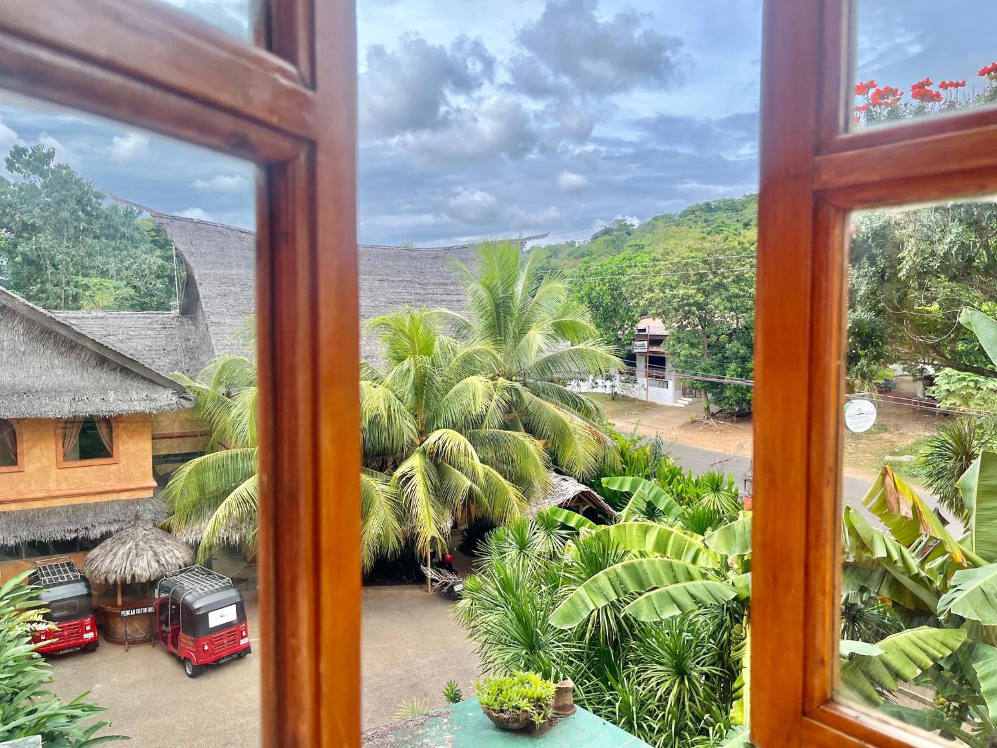 Coco Grove Beach Resort, Siquijor Island Номер фото View from the window of a guest house in the village of Kumburupiddy